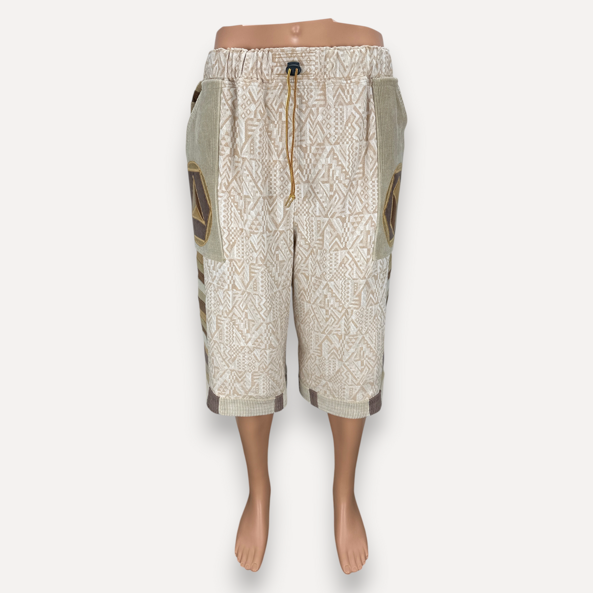 nowAwear medium length shorts in beige cotton with geometric patterns, corduroy side panels, and an elastic drawstring