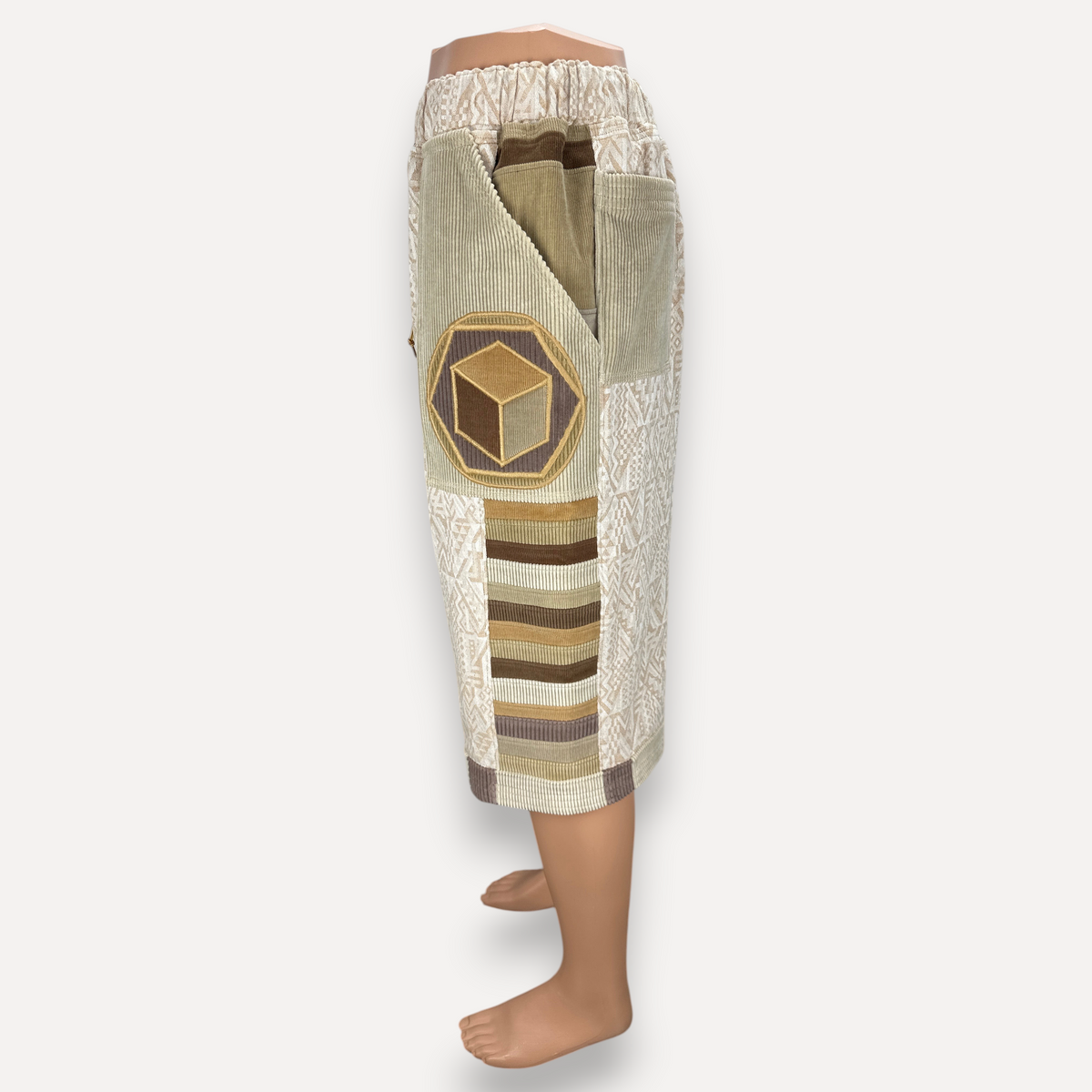 nowAwear medium length shorts in beige and brown corduroy with geometric patterns and a cube patch detail