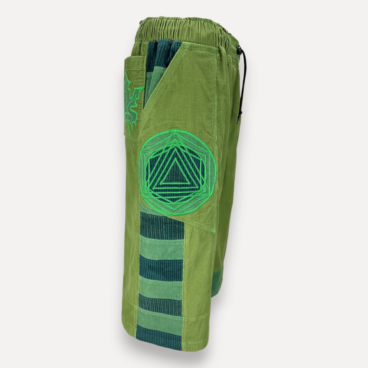 nowAwear medium green corduroy shorts featuring a geometric triangle embroidery and dark green striped side panels.