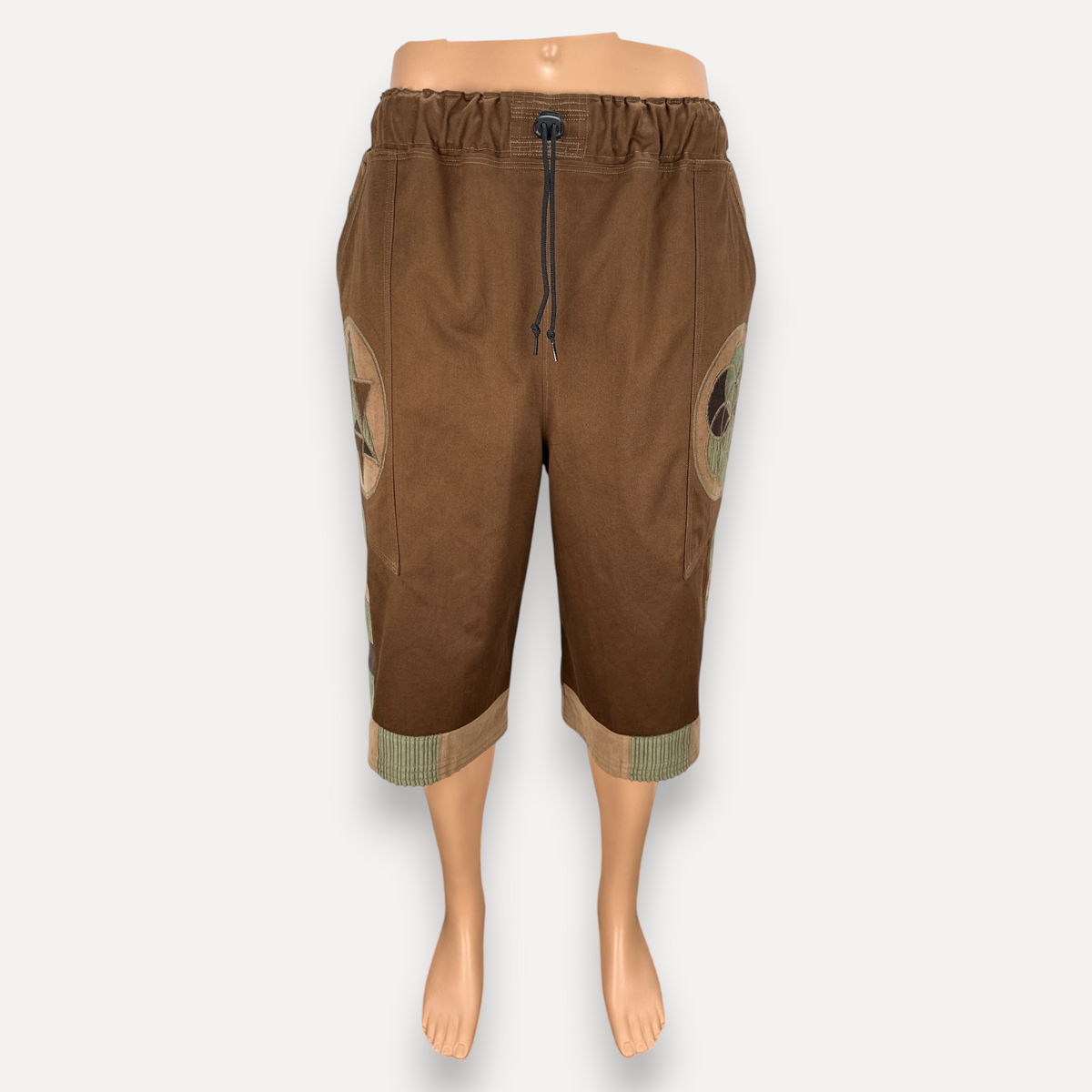 nowAwear brown medium twill shorts with an elastic drawstring waist and decorative circular side patches