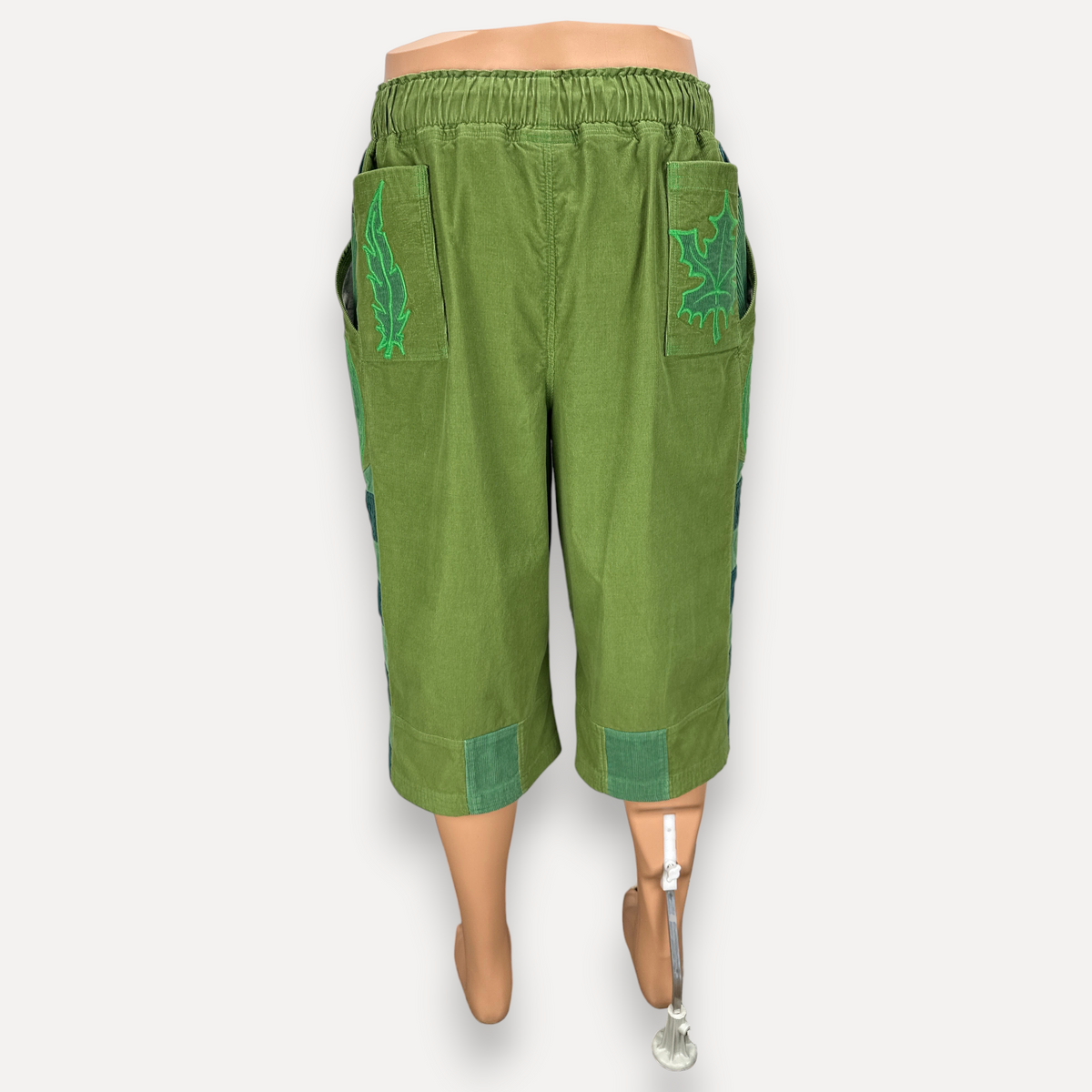 nowAwear medium green cotton shorts with elastic waistband, side pockets, and leaf embroidery detail