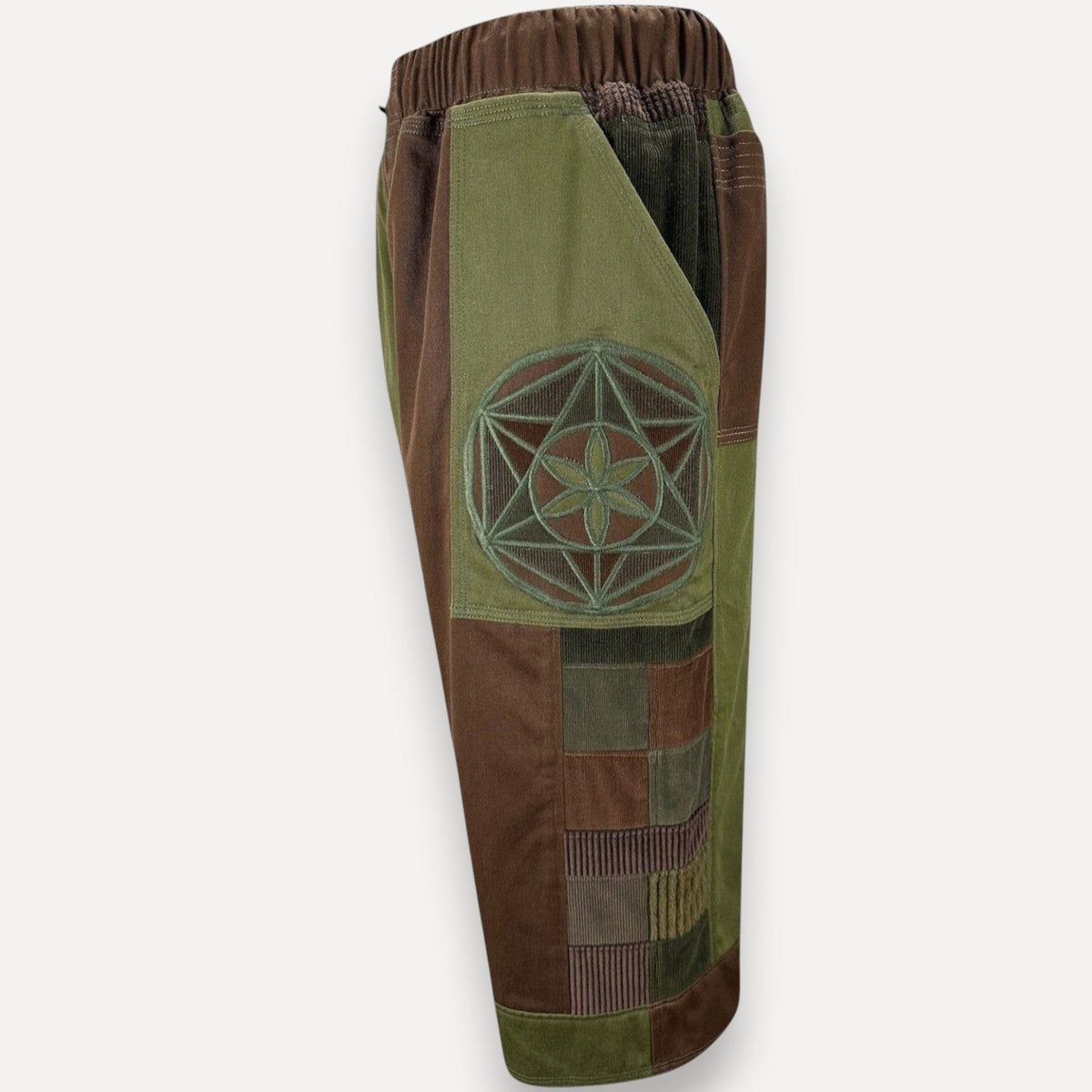 nowAwear patchwork corduroy shorts in olive green and brown with a geometric flower of life embroidery detail